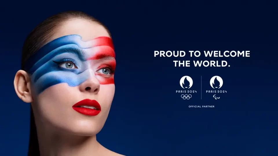 A picture of a woman with make-up resembling the French flag. 